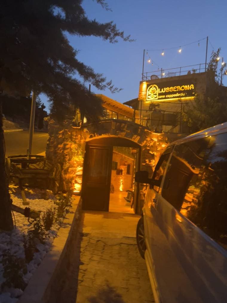 Lubberona Cave Cappadocia entrance lit up at dusk
