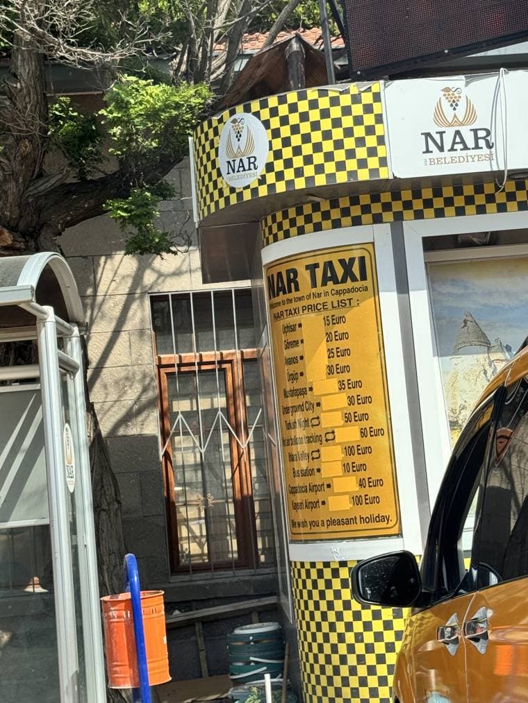 Nar village taxi stand with a posted fare list